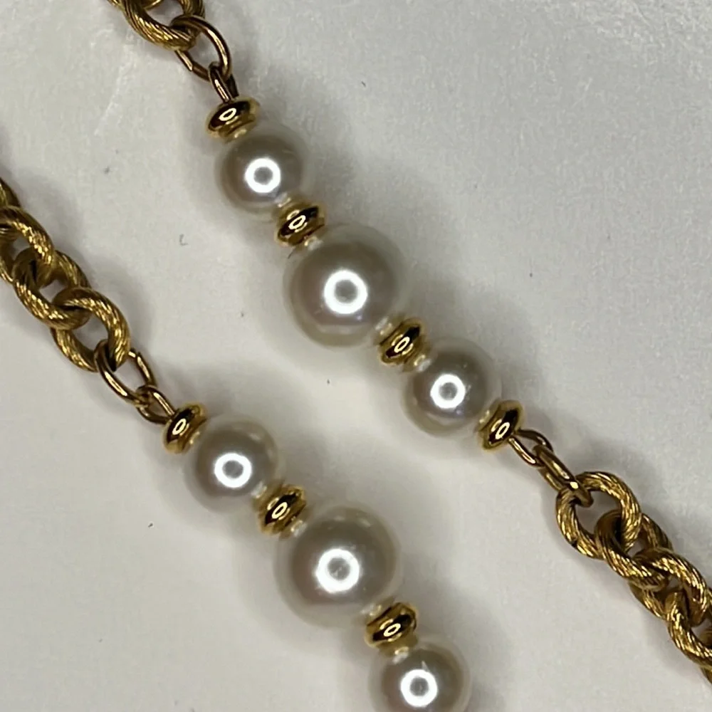 Napier single strand gold tone chain with faux pearls.